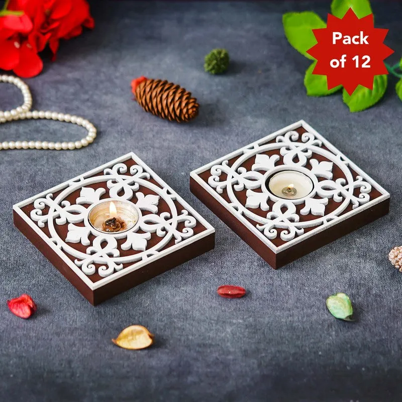 Two square brown and white wooden tea light holders with ornate floral cutwork