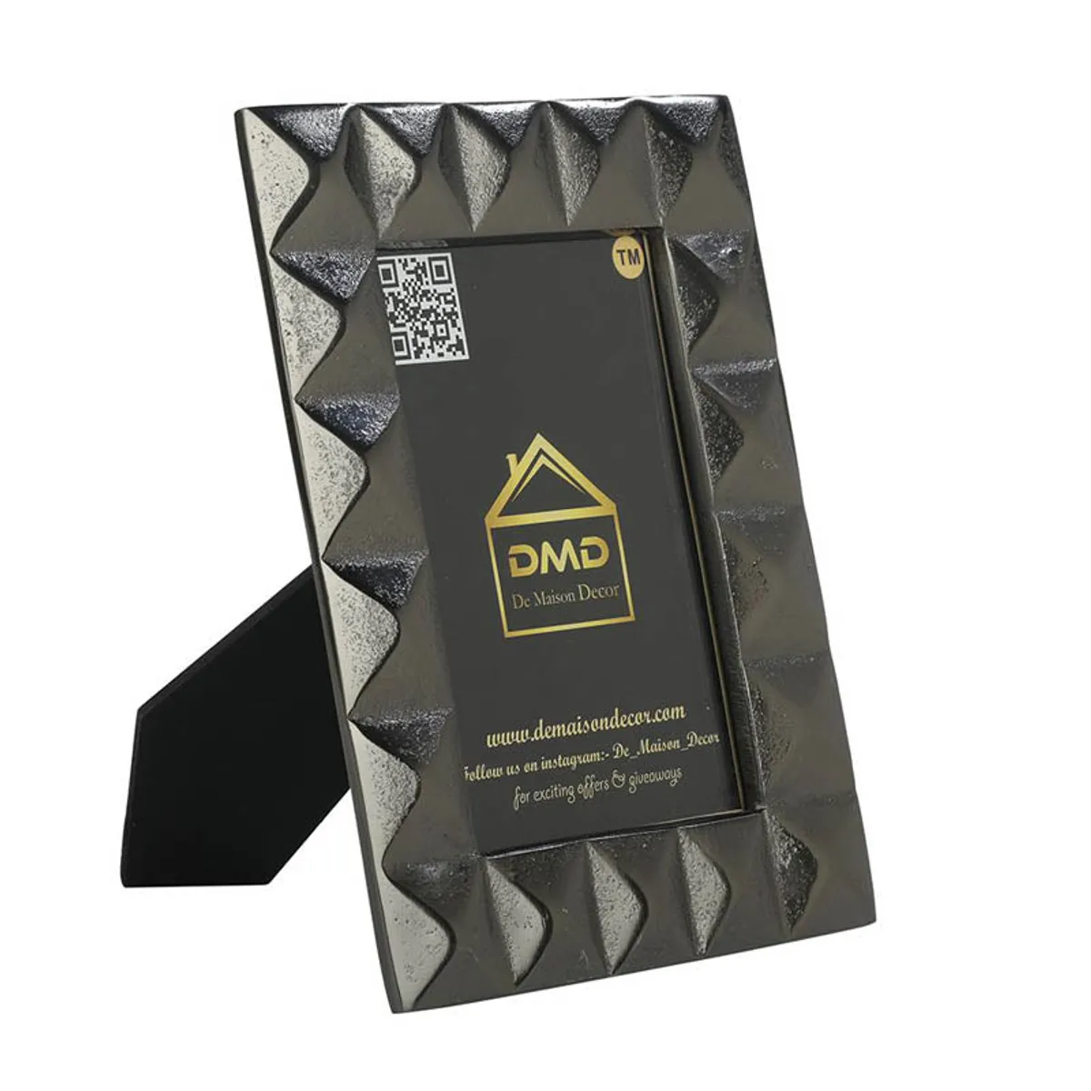 Angled rear view of black aluminium tabletop photo frame with textured border