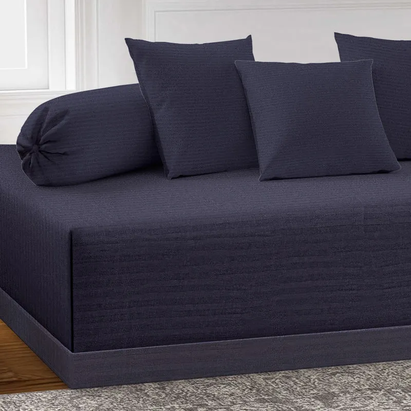 Close view of midnight blue diwan set with cushions and bolster