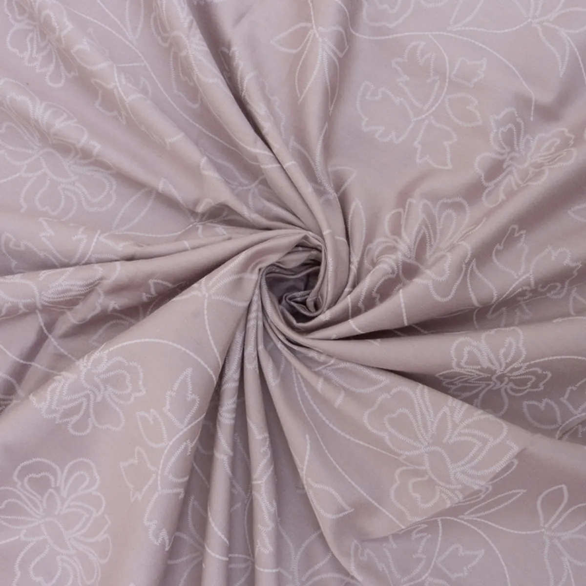 Close-up of soft pink-lavender fabric with white floral outlines