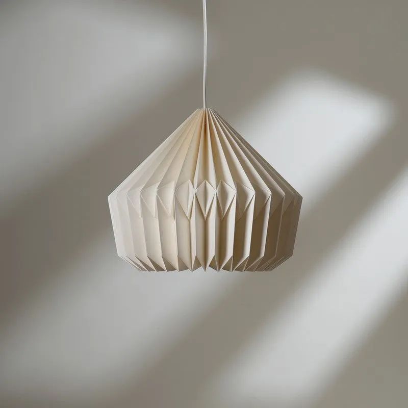 Unlit off-white paper pendant lamp with crisp pleated folds