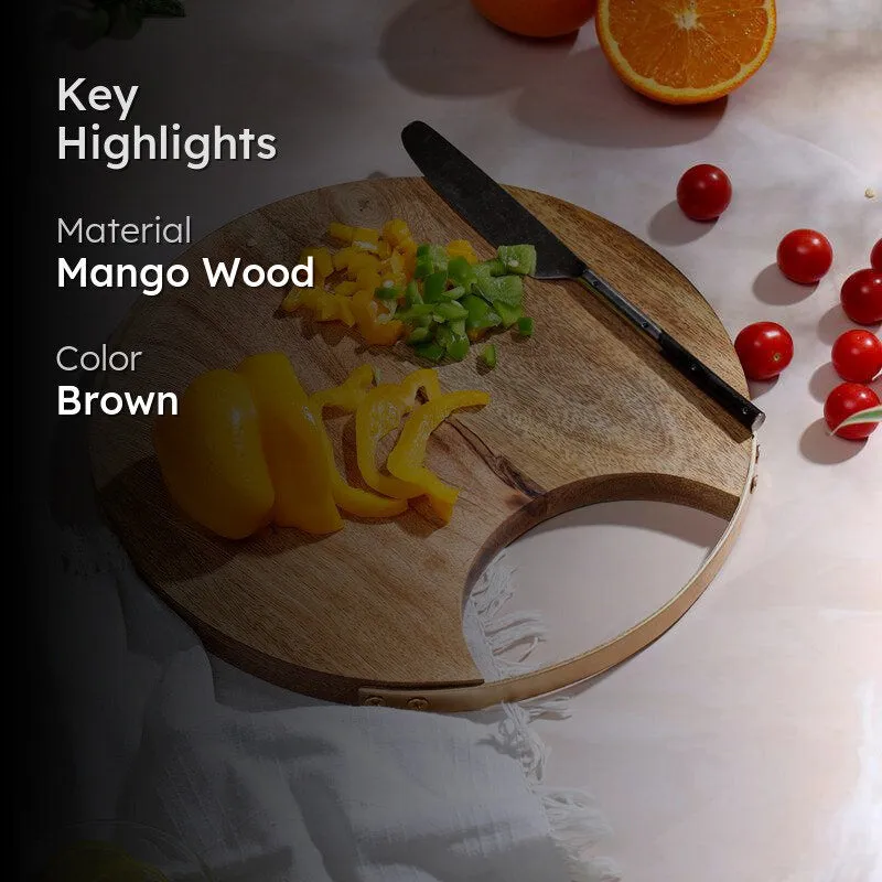 Round mango wood chopping board styled with vegetables and a knife