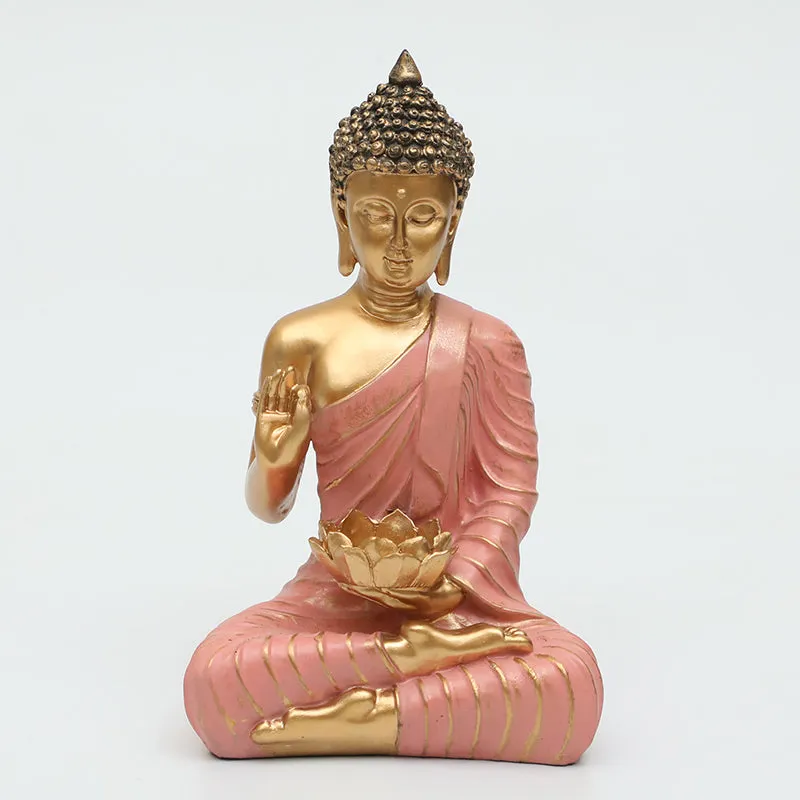 Front view of pink and gold Buddha idol with lotus detail