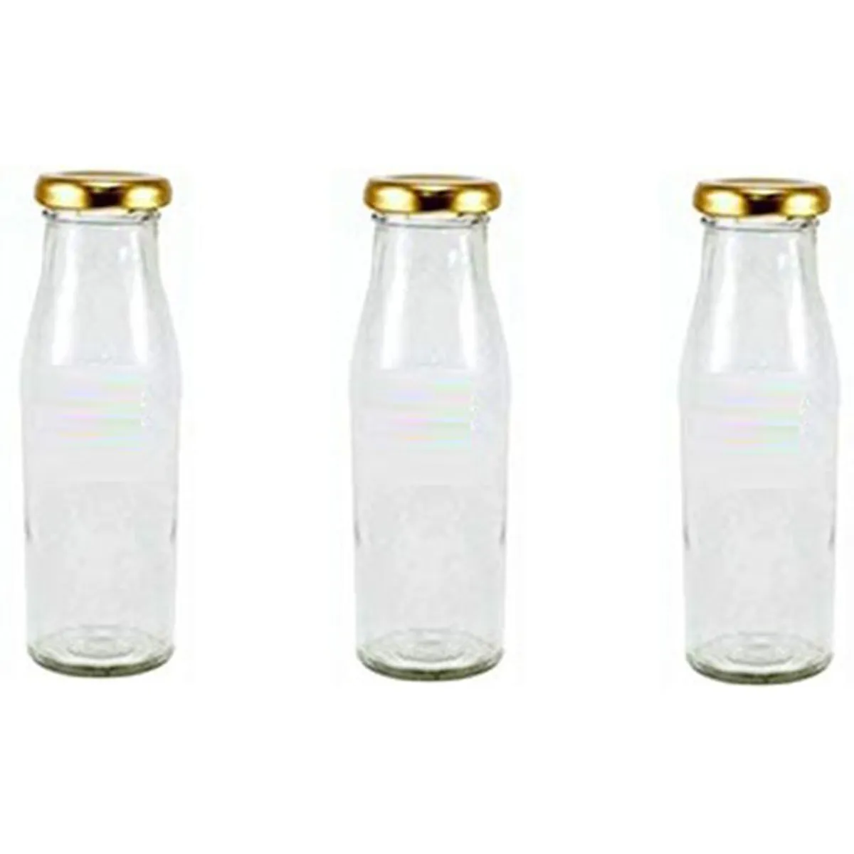 Three transparent glass bottles with glossy gold-coloured caps