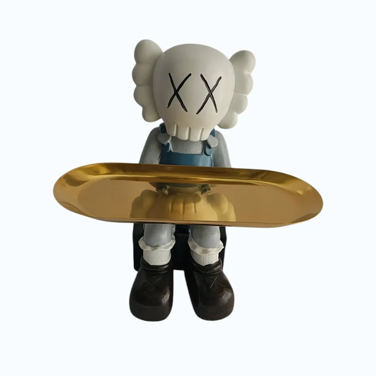 Close front view of the cartoon figurine and glossy gold tray