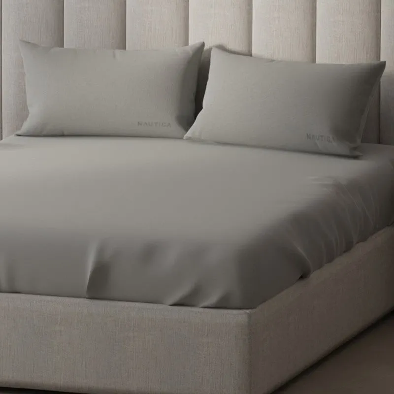 Close-up of smooth silver-grey bedsheet and matching pillow covers