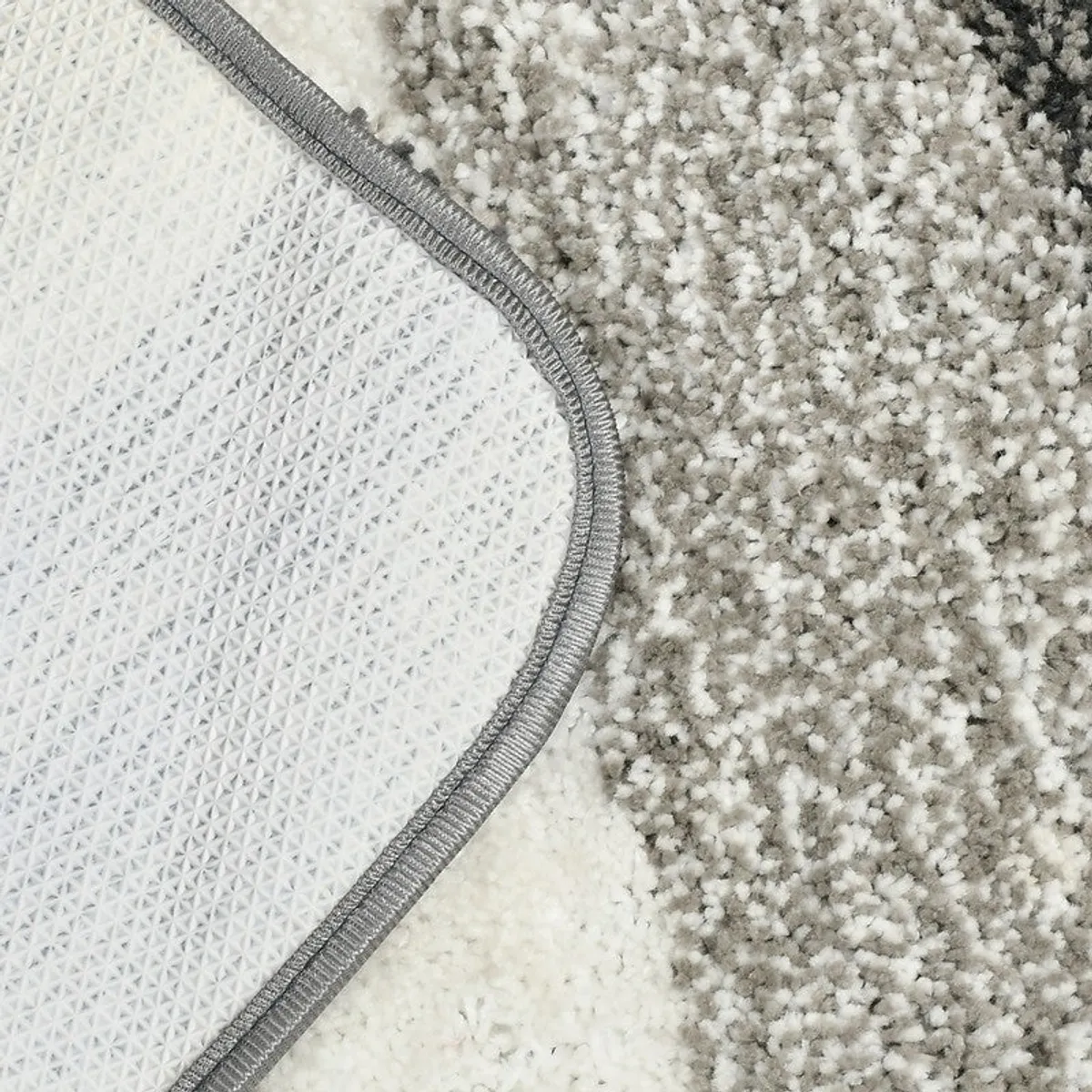 Close-up of the bath mat underside showing its textured rubber backing