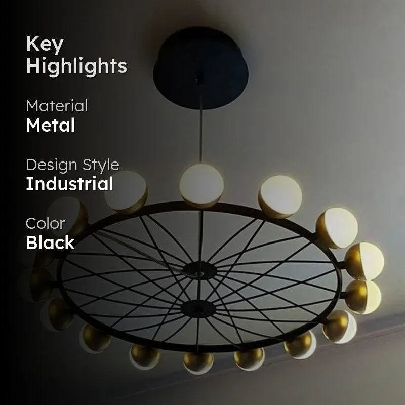 Industrial black chandelier with glowing globes shown in a dark room.