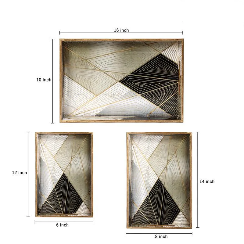 Close-up of the matte black and gold geometric tray surface and handles