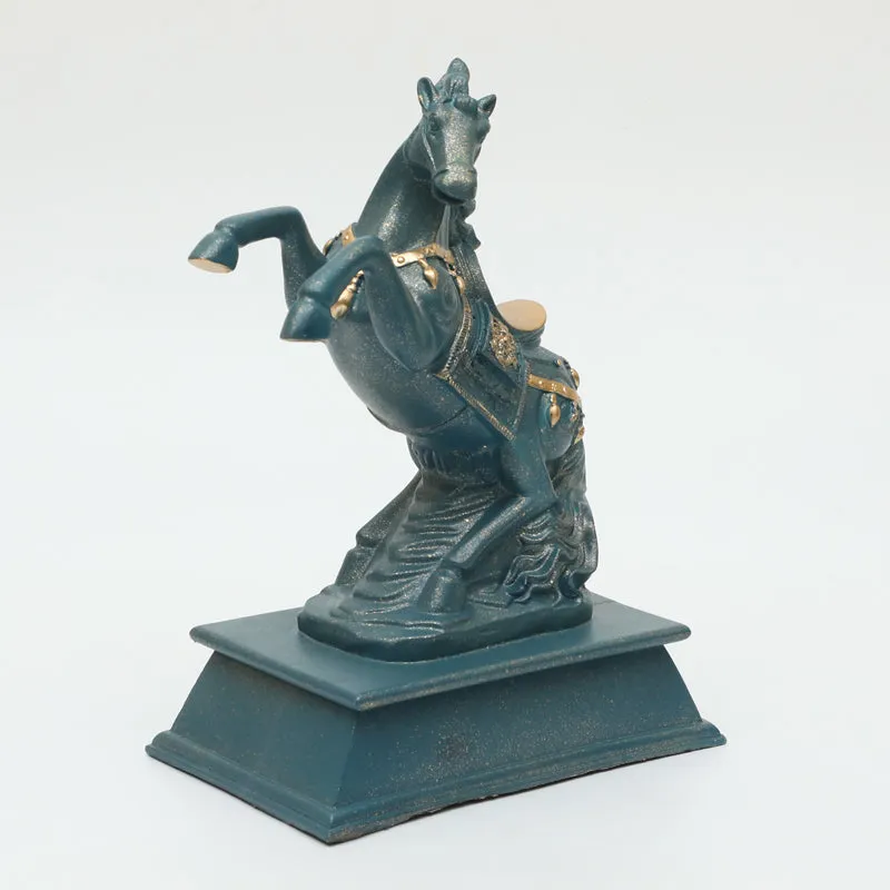 Angled front view of a grey rearing horse showpiece on a pedestal base