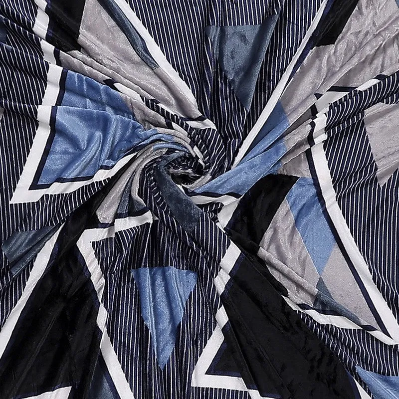 Close-up view showing the textured-looking geometric blue and black bedsheet pattern