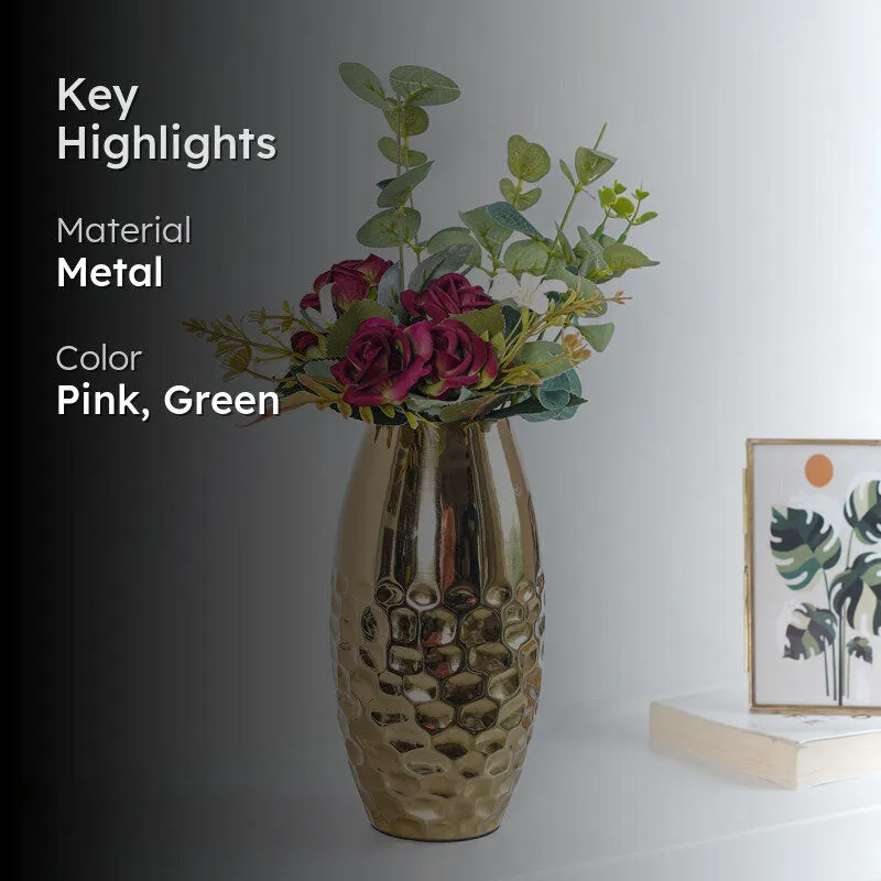 Artificial rose bouquet in a gold metal vase with pink and green tones