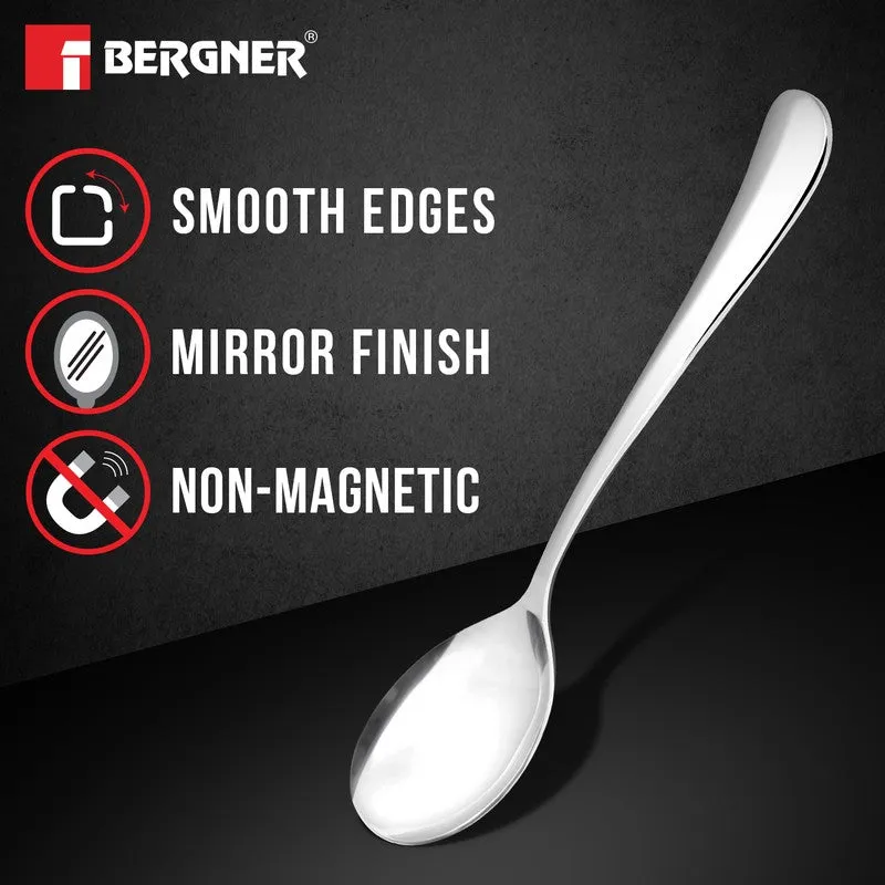 Single silver soup spoon shown against a dark background