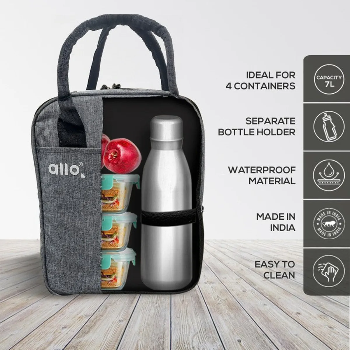 Open grey lunch bag with food containers and a bottle inside