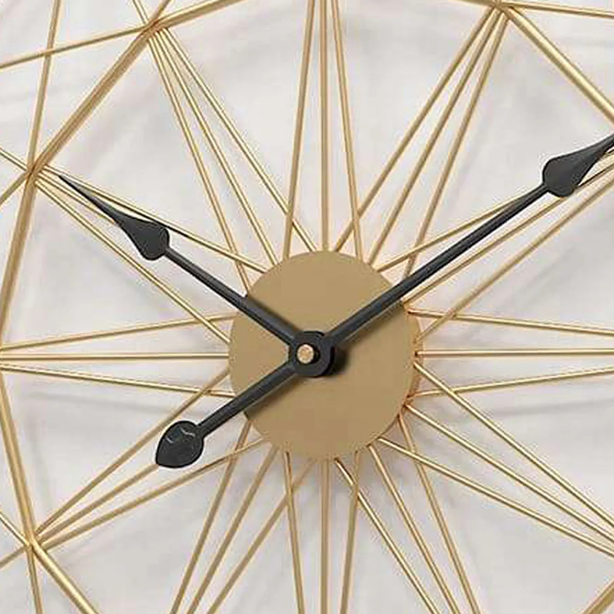 Detail of the gold wireframe clock centre with black analogue hands