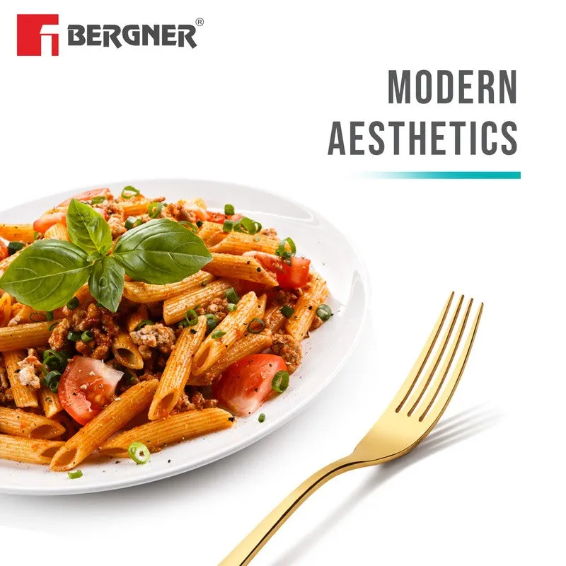 Gold fork placed beside a plate of pasta on a white background