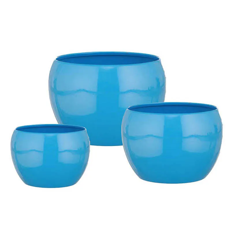 Set of three glossy blue round planters on a plain white background.