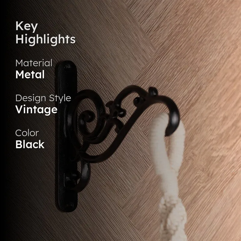 Black scrolling wall bracket shown with visible material and vintage design details.