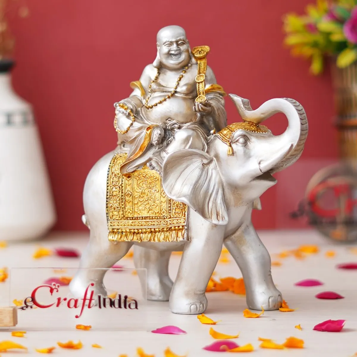 Front view of silver and gold deity-on-elephant showpiece