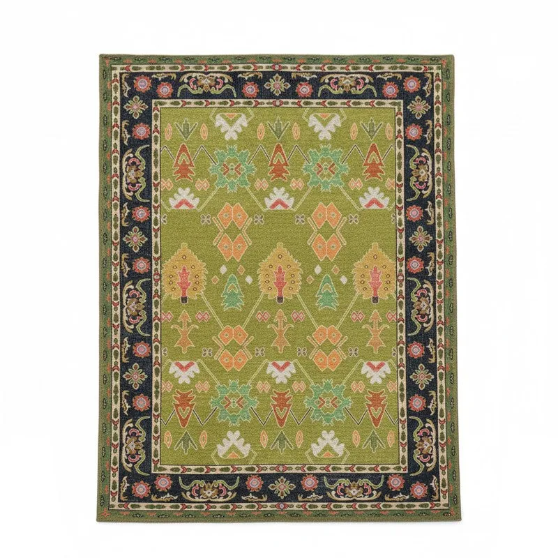 Rectangular moss green carpet with an intricate ethnic motif and dark floral border