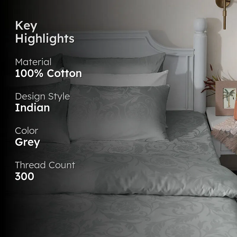 Light grey floral duvet cover displayed on a bed in a bedroom setting