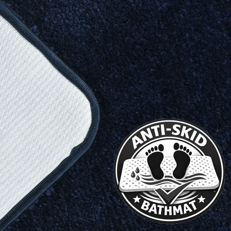 Underside of the dark blue bath mat with anti-skid backing visible