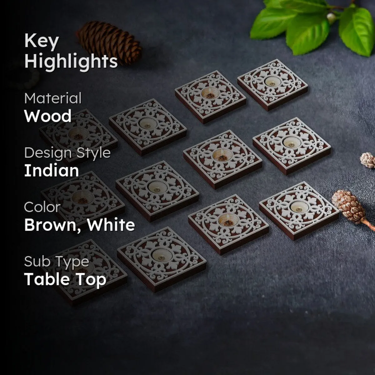 Twelve square brown and white tea light holders arranged on a dark surface