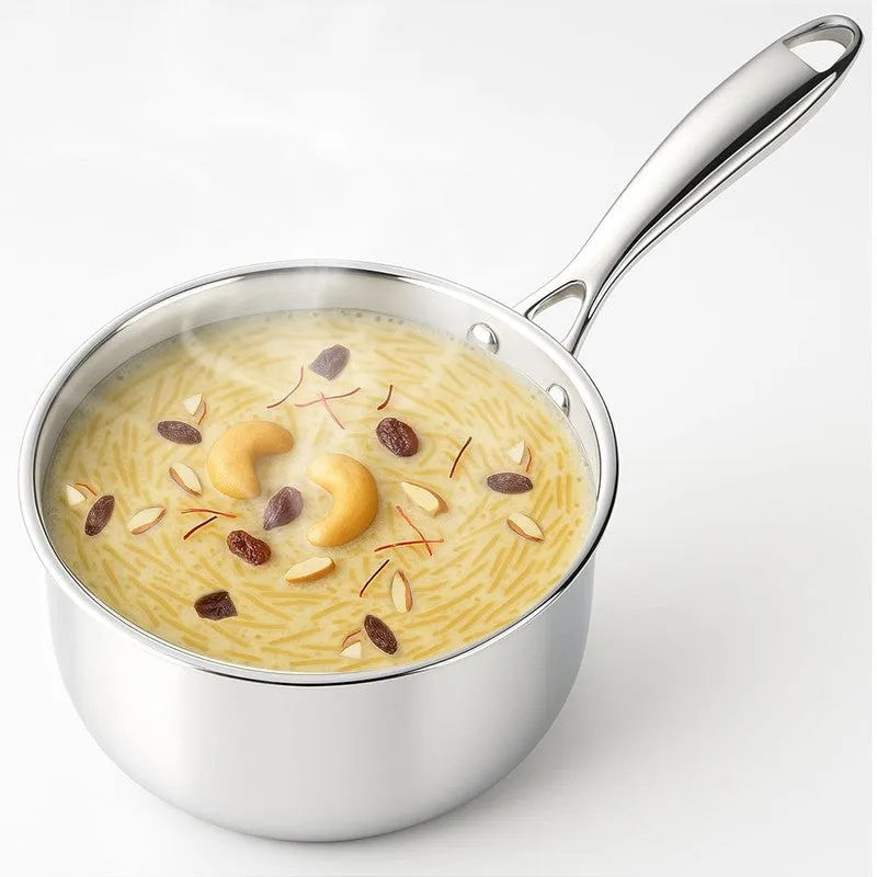 Close-up of a silver stainless steel saucepan with a long handle filled with dessert