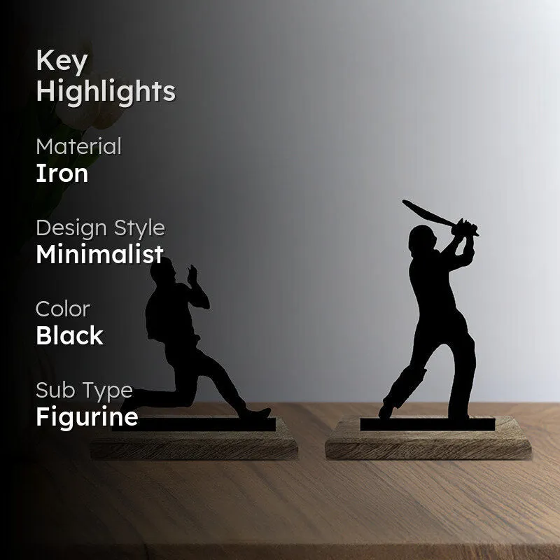 Two black cricket figurines on wooden bases with a dark text overlay
