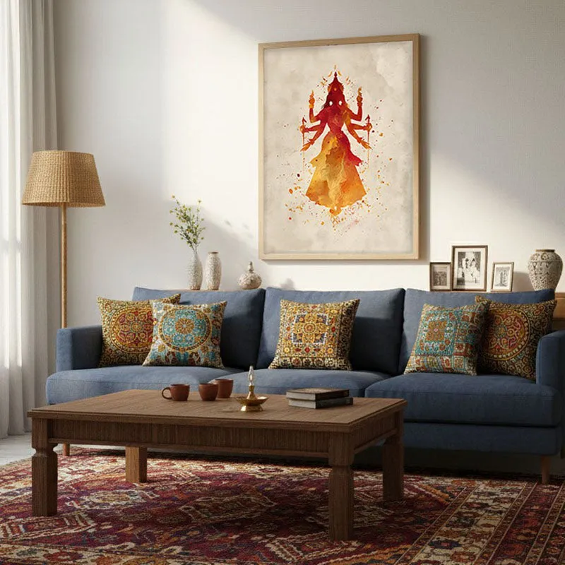 Framed Durga wall art displayed above a blue sofa in a living room