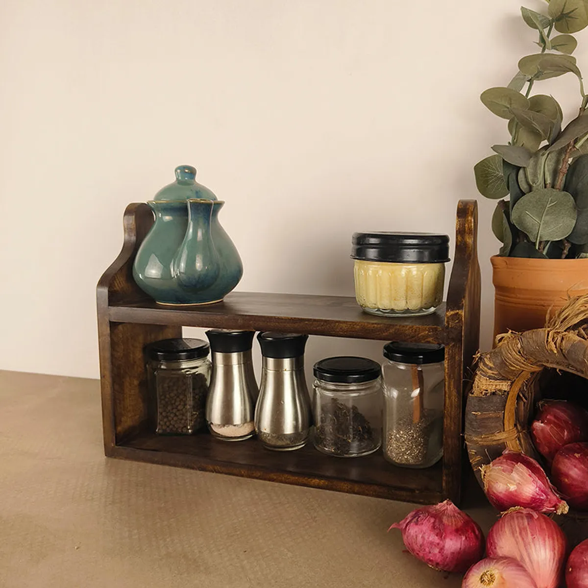 Brown wooden kitchen stand displayed with spice jars and a teapot