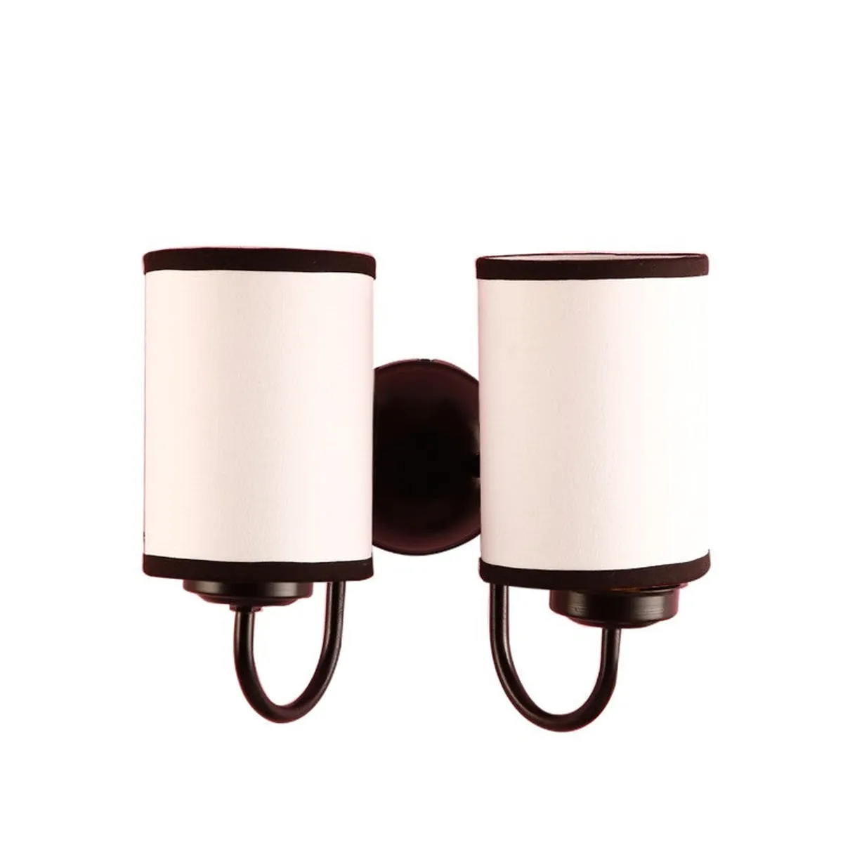 Studio view of dual wall lamp with white cylindrical shades and dark frame