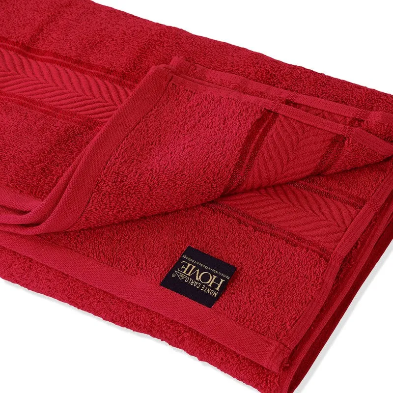 Close-up of the red towel's plush texture and decorative border