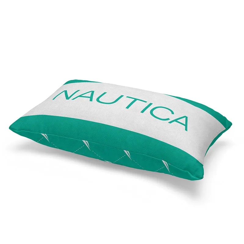 Angled view of teal and white NAUTICA cushion cover with sailboat detailing