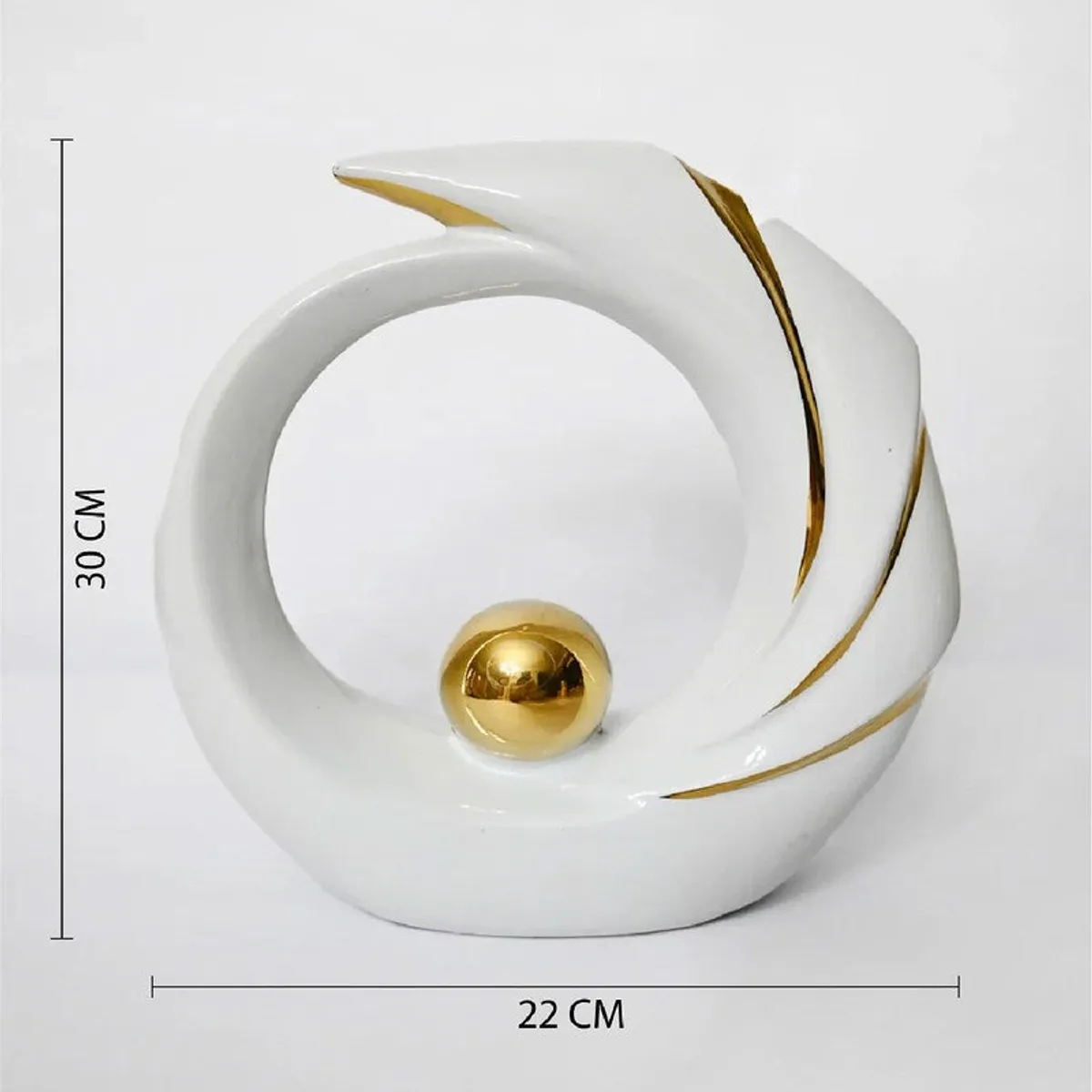 Front view of a white and gold sculptural showpiece on a plain background
