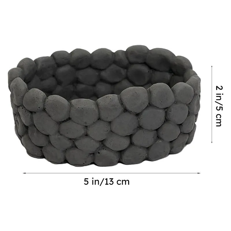 Grey oval accent bowl with dimension markers on a white background