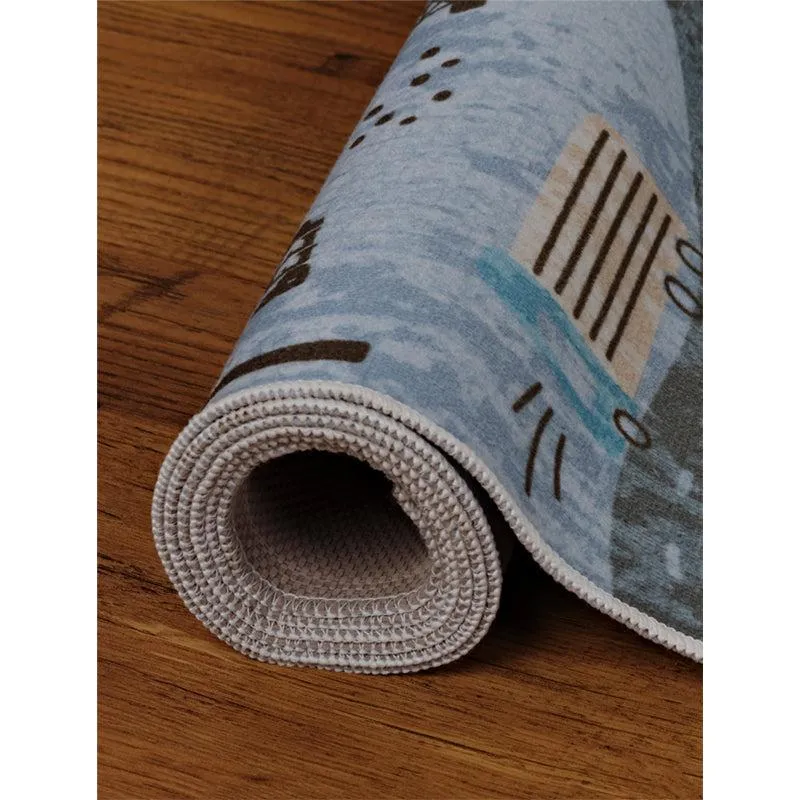 Rolled blue polyester carpet showing the underside and edge finish