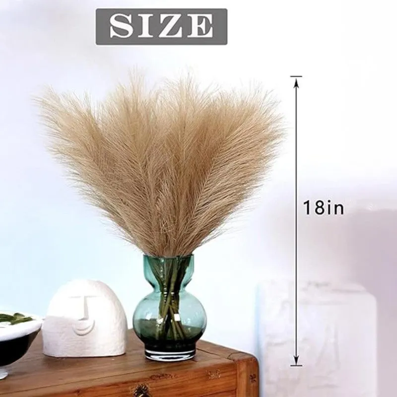 Brown pampas grass arrangement shown in a small blue glass vase