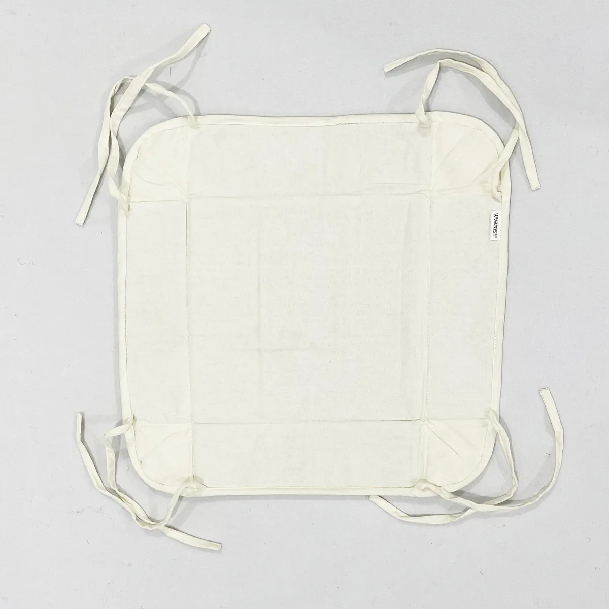 Flat lay of the bread basket opened out with corner ties visible