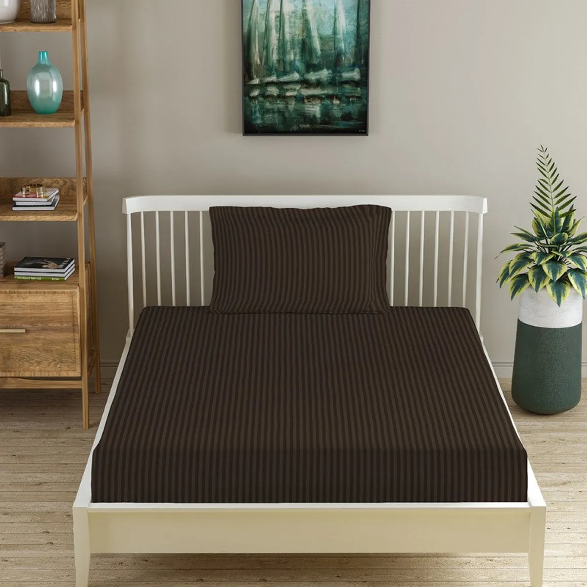 Brown striped fitted bedsheet on a single bed with matching pillow cover