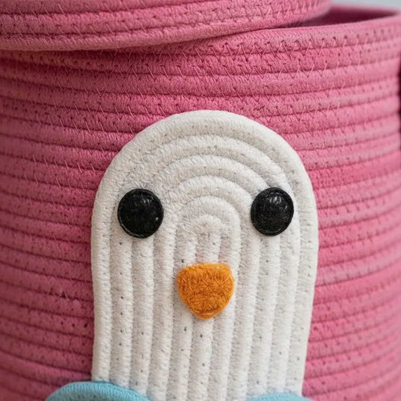 Close-up of the penguin applique on the pink woven basket