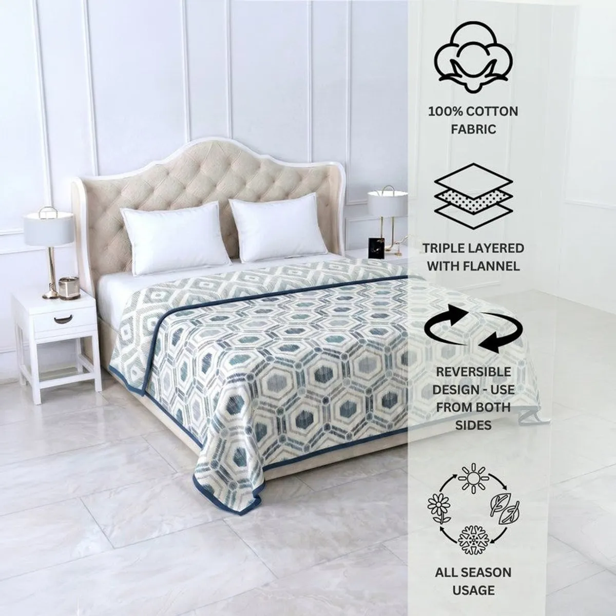Blue and off-white reversible dohar styled on a bed