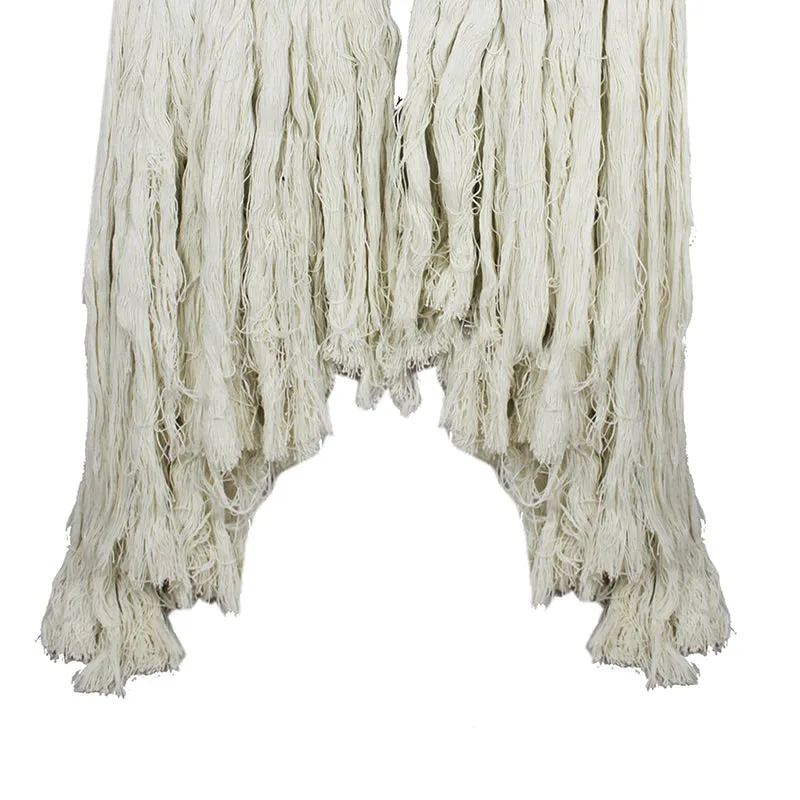 Close-up of the cream wool tassels hanging from a rainbow wall accent