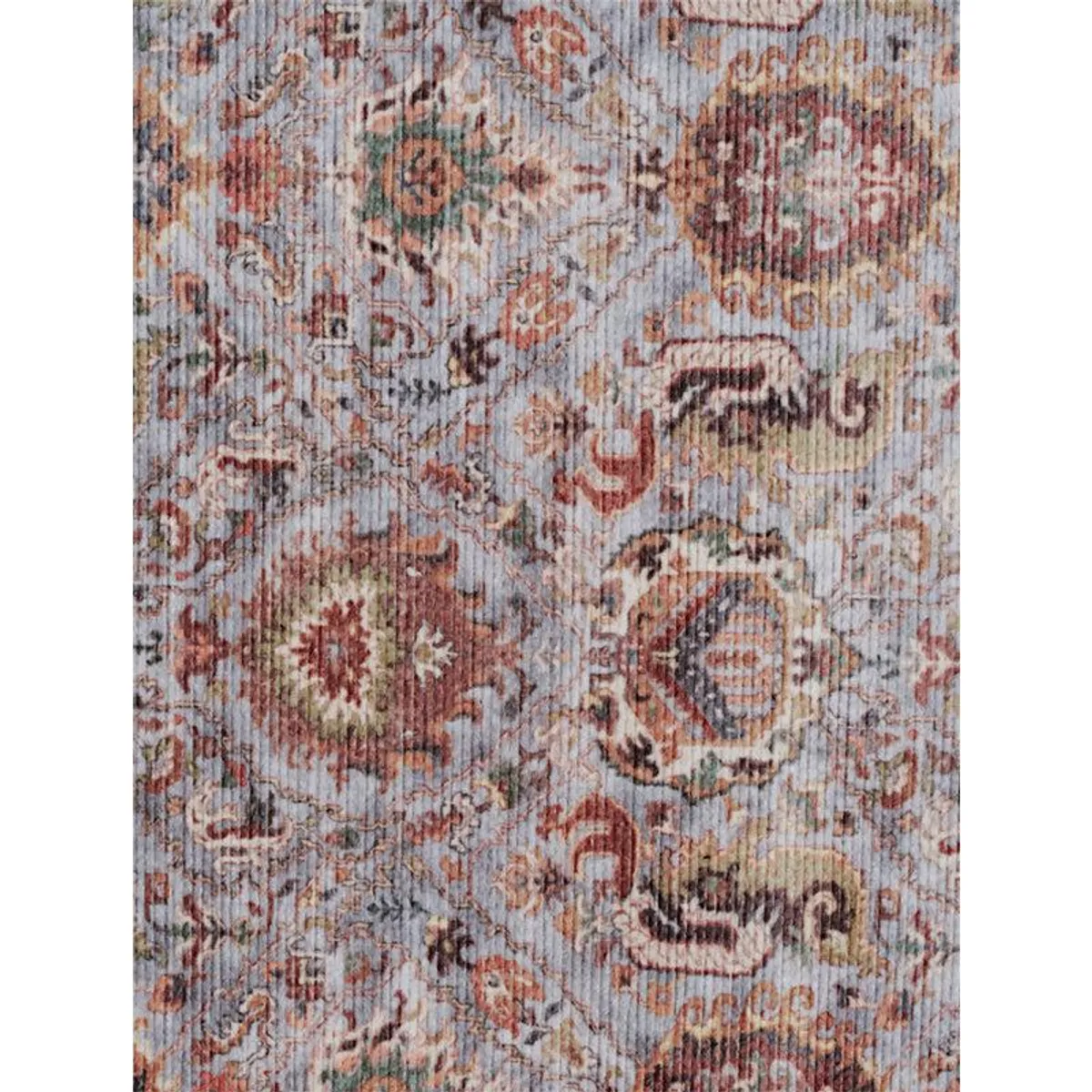 Close-up view of the carpet's muted multicolour patterned surface