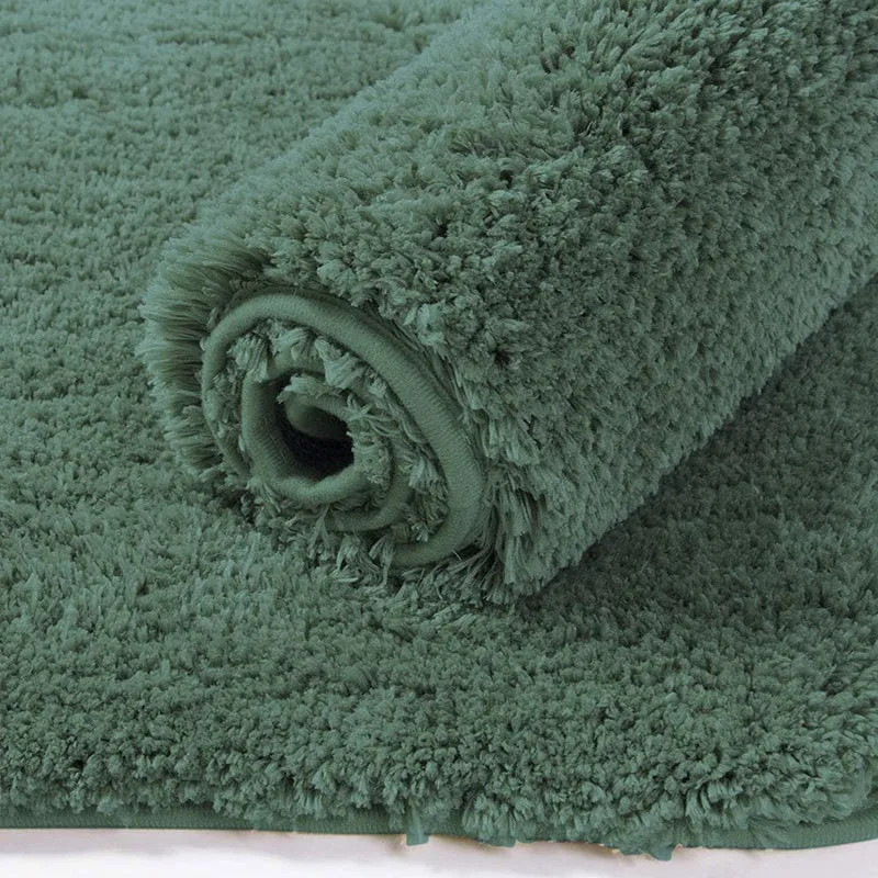 Rolled green runner rug showing its plush textured pile
