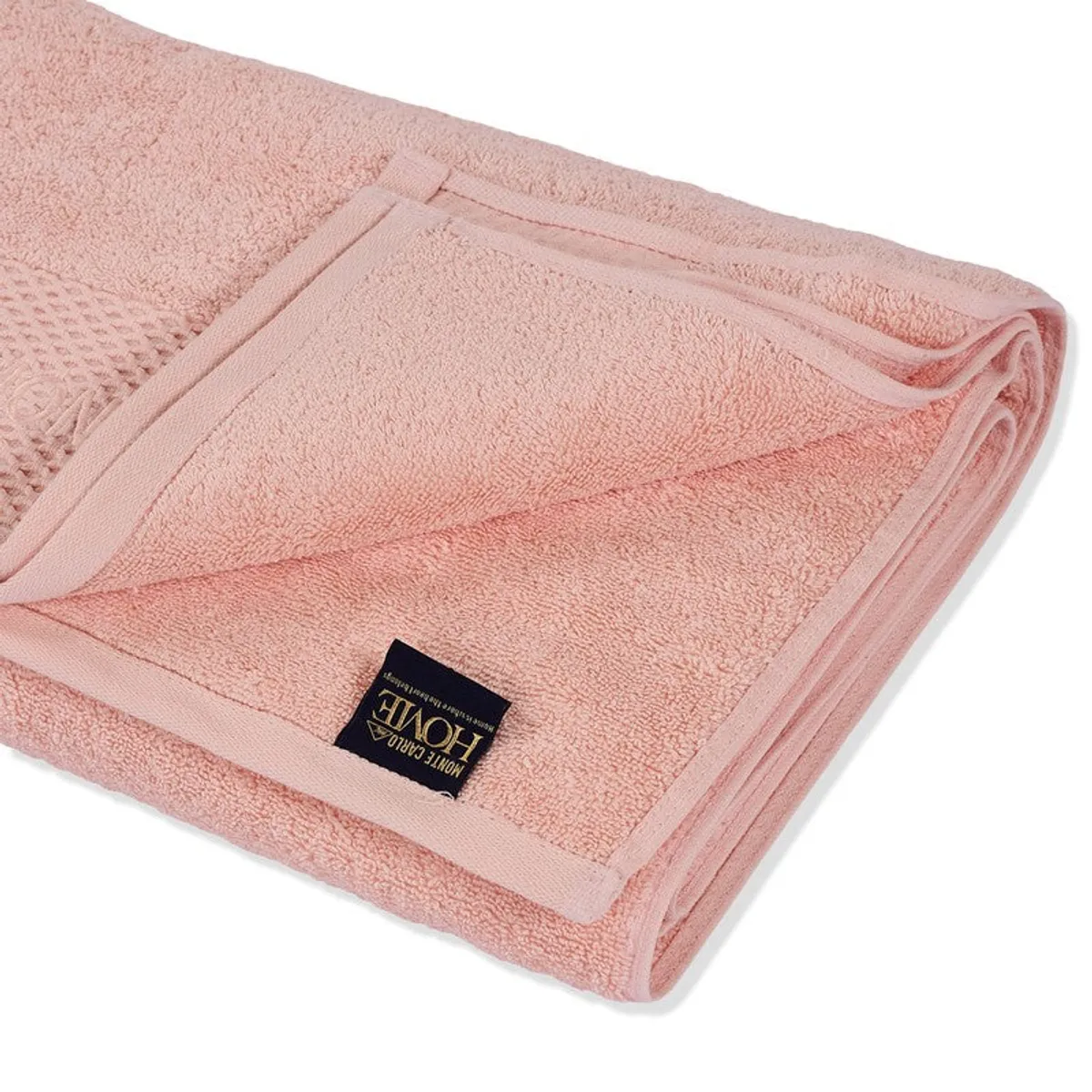 Close-up of the folded pink towel showing its soft pile and stitched edges