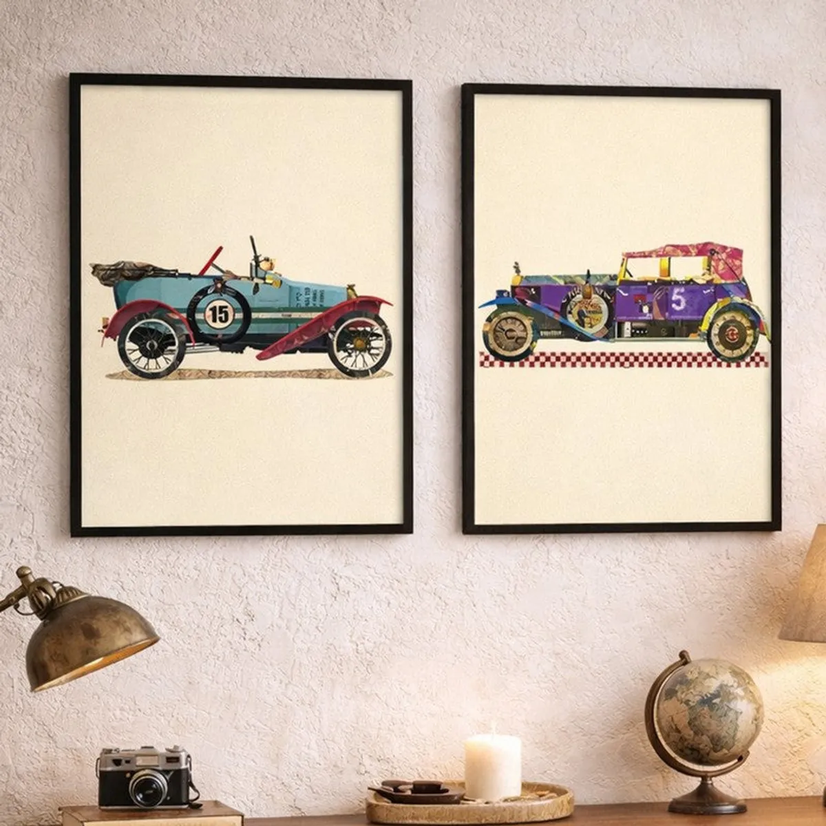 Pair of black-framed art prints with colourful vehicle motifs styled above a console