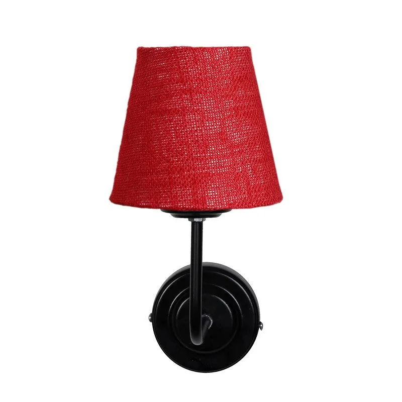 Straight-on view of red cone jute wall lamp on white background