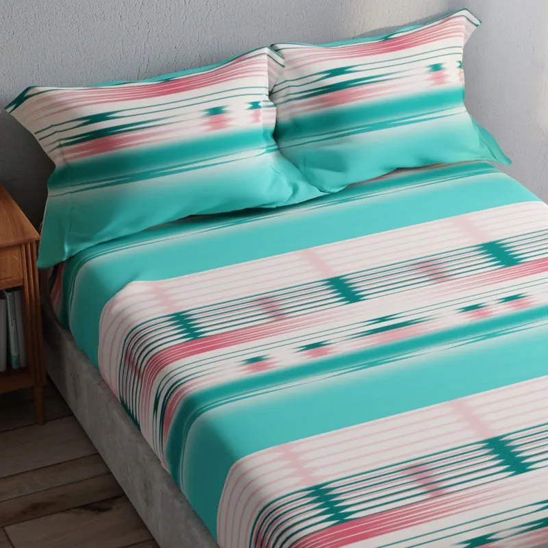 Angled view of sea green bedsheet with pink, white and teal geometric stripes