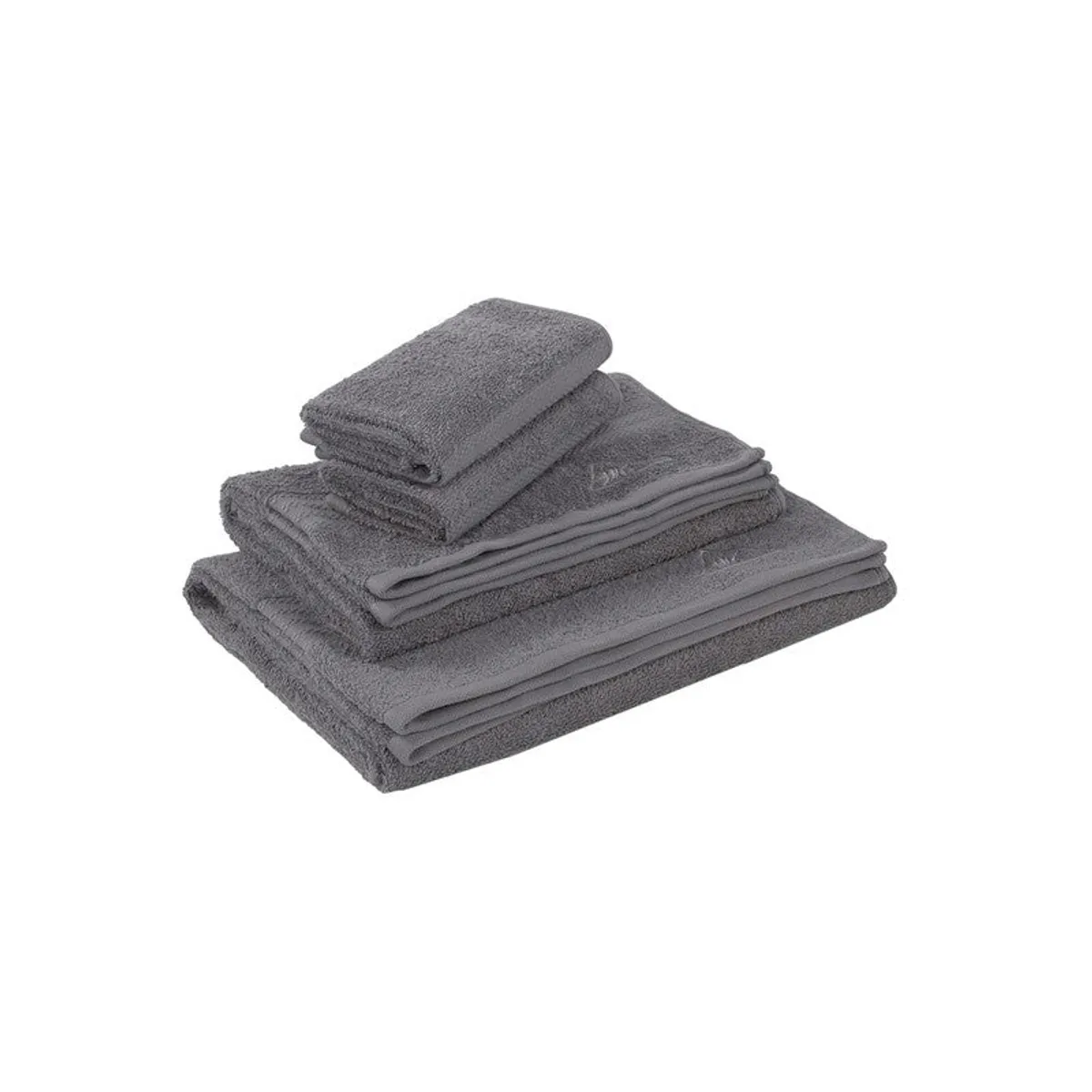 Folded set of dark grey towels on a white background